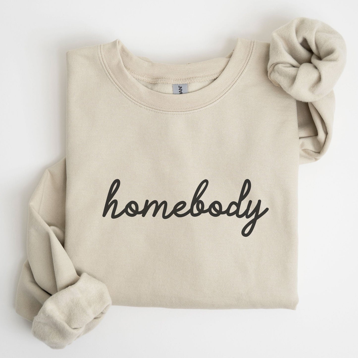 “Homebody” sweatshirt with minimalist script design — cozy neutral crewneck perfect for introverts and lovers of slow days.