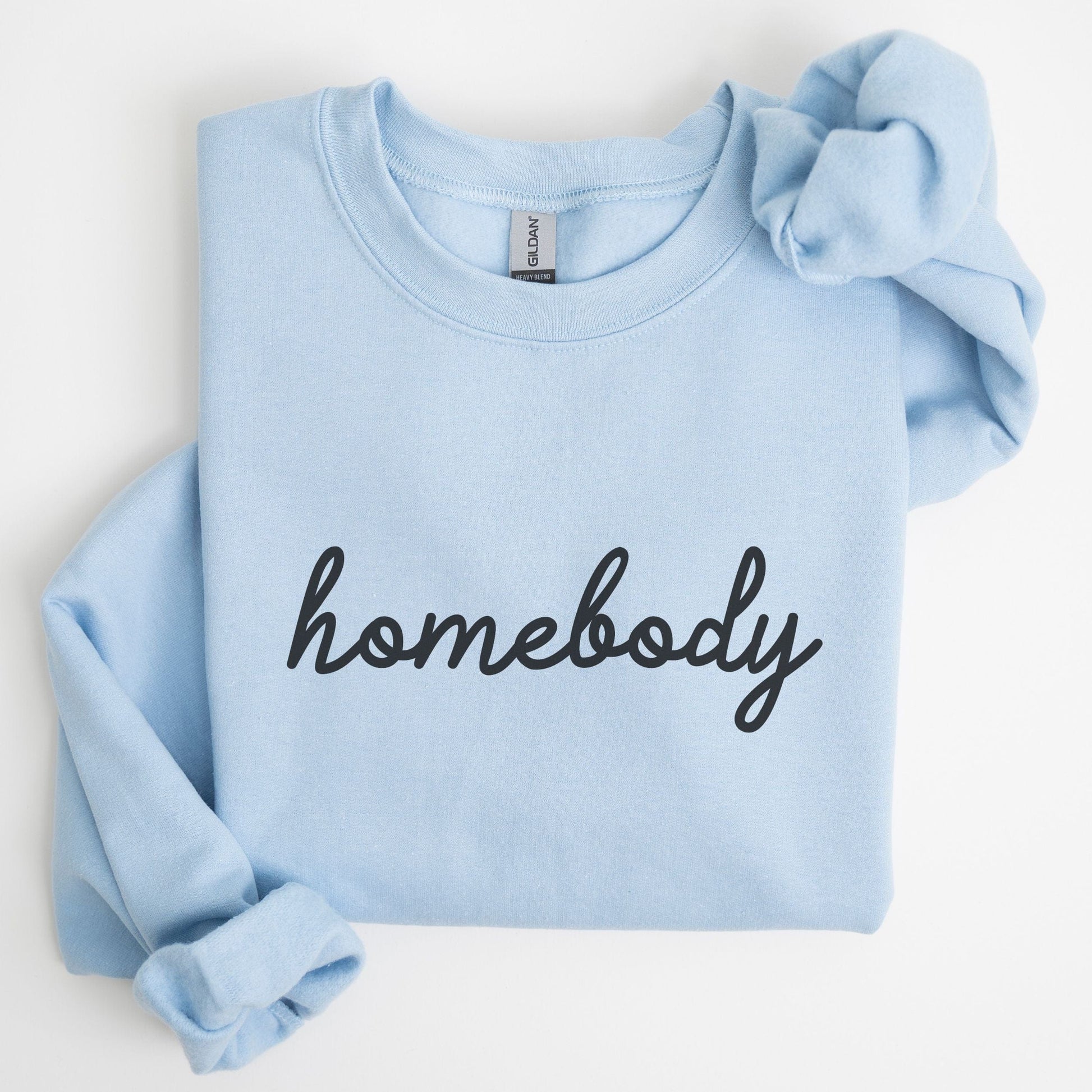 “Homebody” sweatshirt with minimalist script design — cozy neutral crewneck perfect for introverts and lovers of slow days.