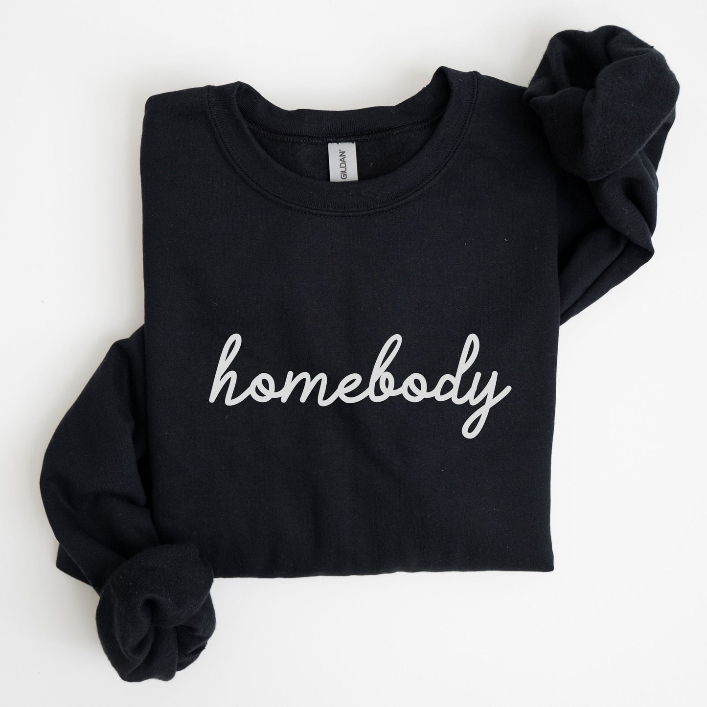 “Homebody” sweatshirt with minimalist script design — cozy neutral crewneck perfect for introverts and lovers of slow days.