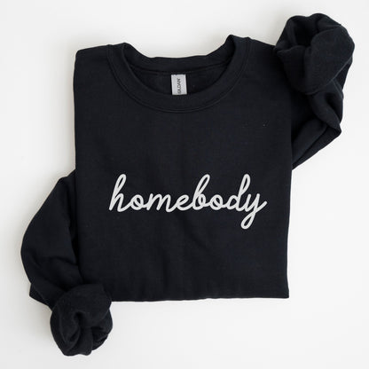 “Homebody” sweatshirt with minimalist script design — cozy neutral crewneck perfect for introverts and lovers of slow days.