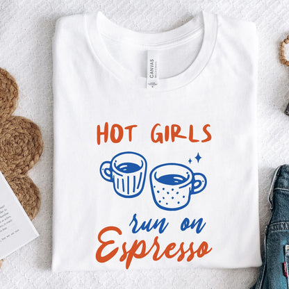 T-shirt with blue and orange graphic of espresso cups and bold text that says "Hot Girls Run on Espresso."