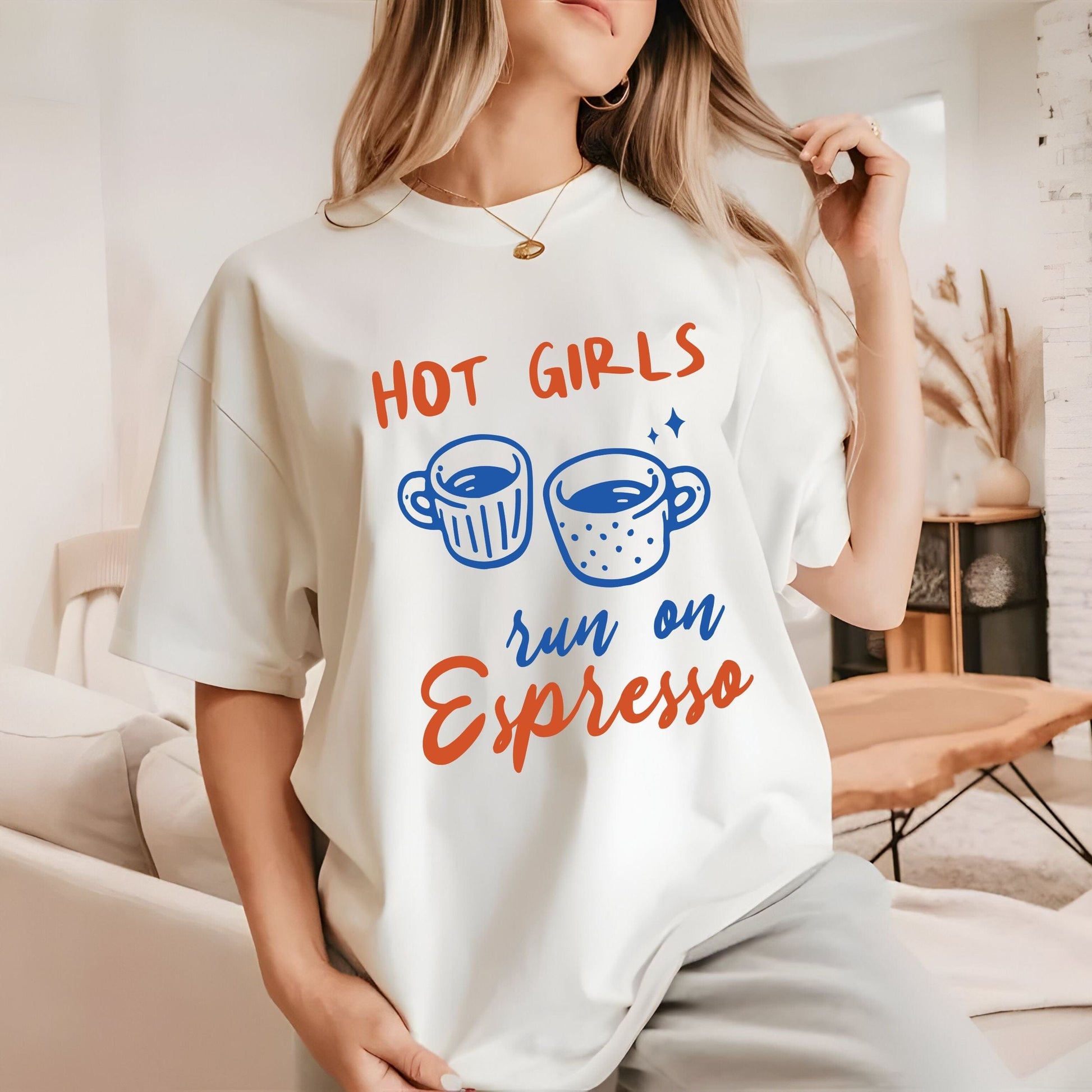 T-shirt with blue and orange graphic of espresso cups and bold text that says "Hot Girls Run on Espresso."