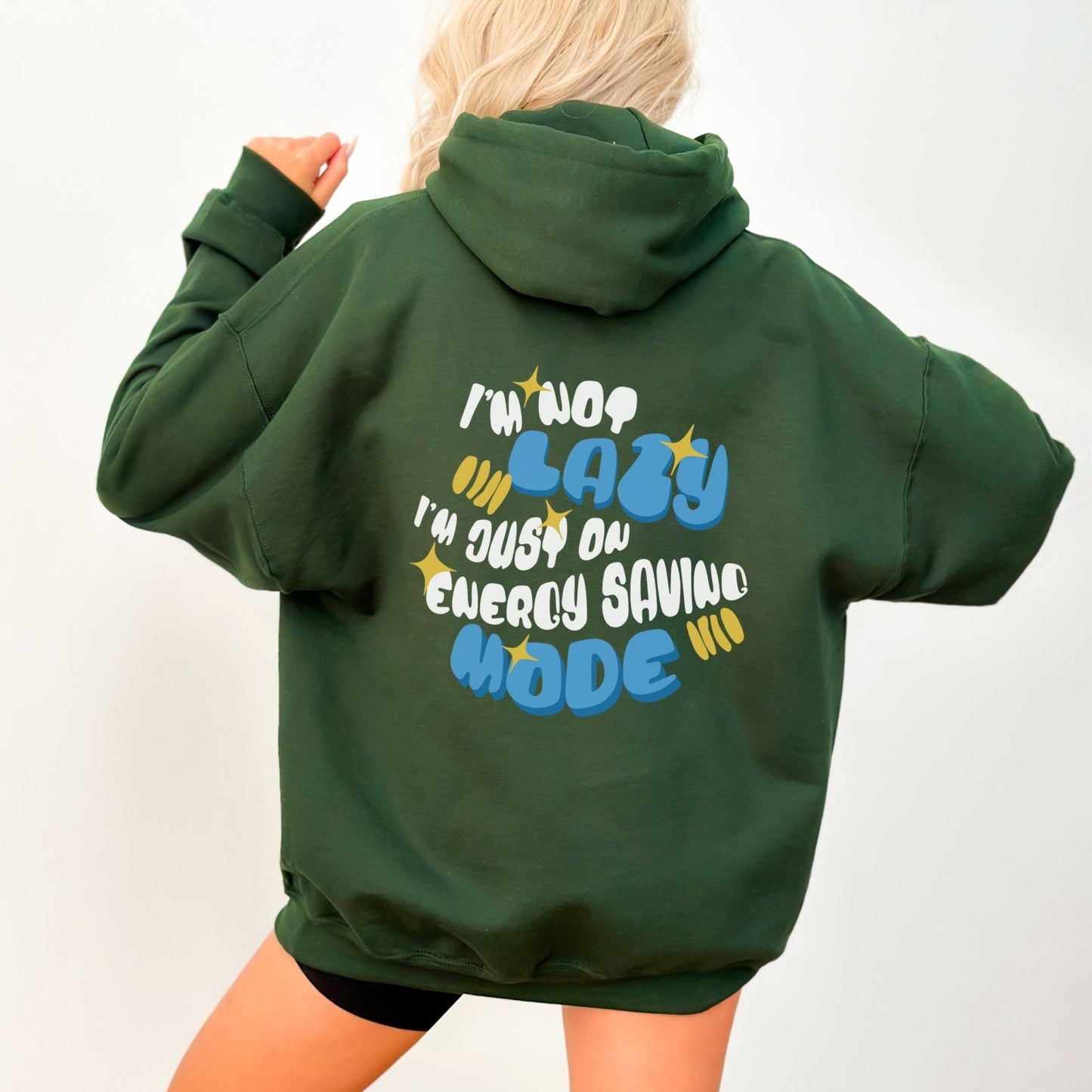 Funny "I'm Not Lazy" hoodie in 4 colors, 50% cotton and 50% polyester, featuring a playful energy-saving mode design.