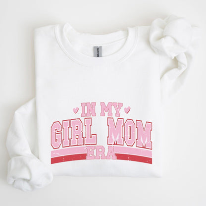 Sweatshirt with “In My Girl Mom Era” text in varsity pink and red lettering — bold and playful design for moms of daughters.