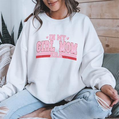 Sweatshirt with “In My Girl Mom Era” text in varsity pink and red lettering — bold and playful design for moms of daughters.
