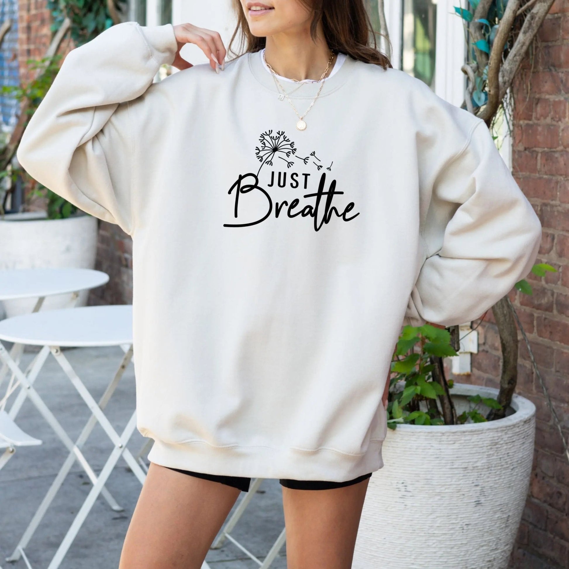 "Just Breathe" sweatshirt from That Cozy Vibe, perfect for mindfulness and wellness.