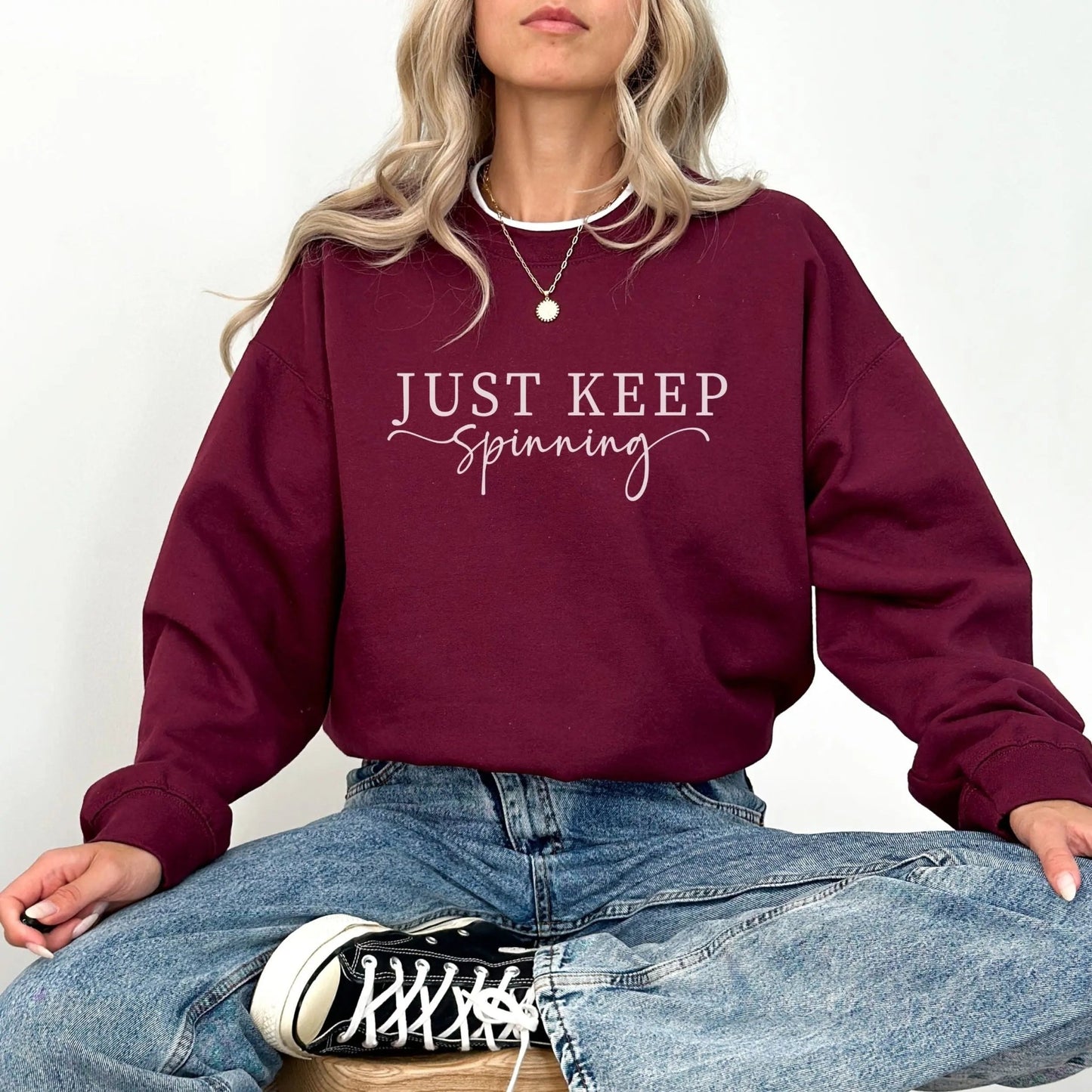 "Just Keep Spinning" sweatshirt from That Cozy Vibe, perfect for fitness and motivation.