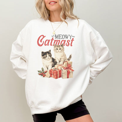 Christmas sweatshirt featuring "Meowy Catmas" with adorable cats and presents.