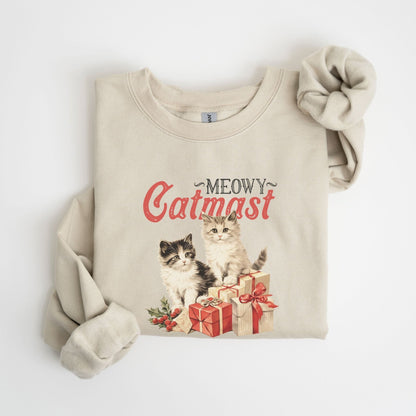 Christmas sweatshirt featuring "Meowy Catmas" with adorable cats and presents.