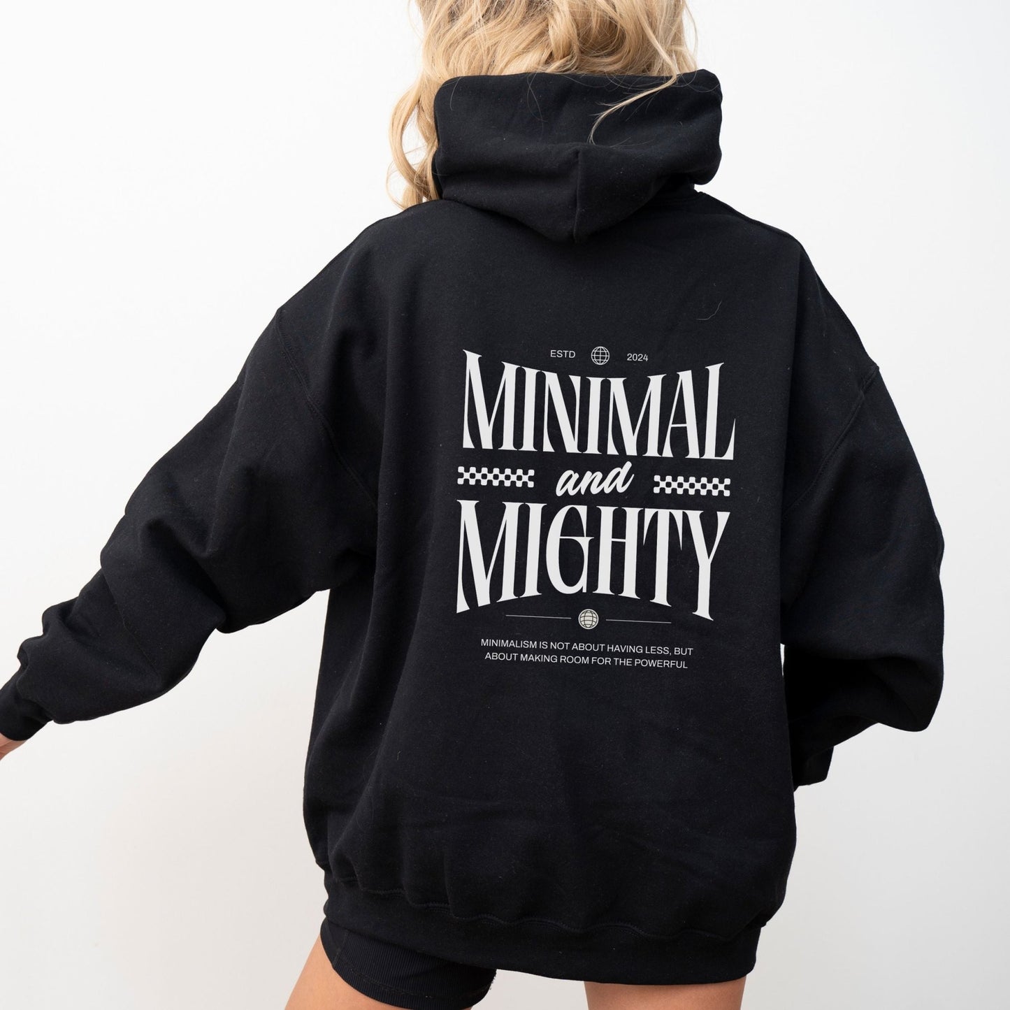 Minimal and Mighty hoodie with bold typography design.