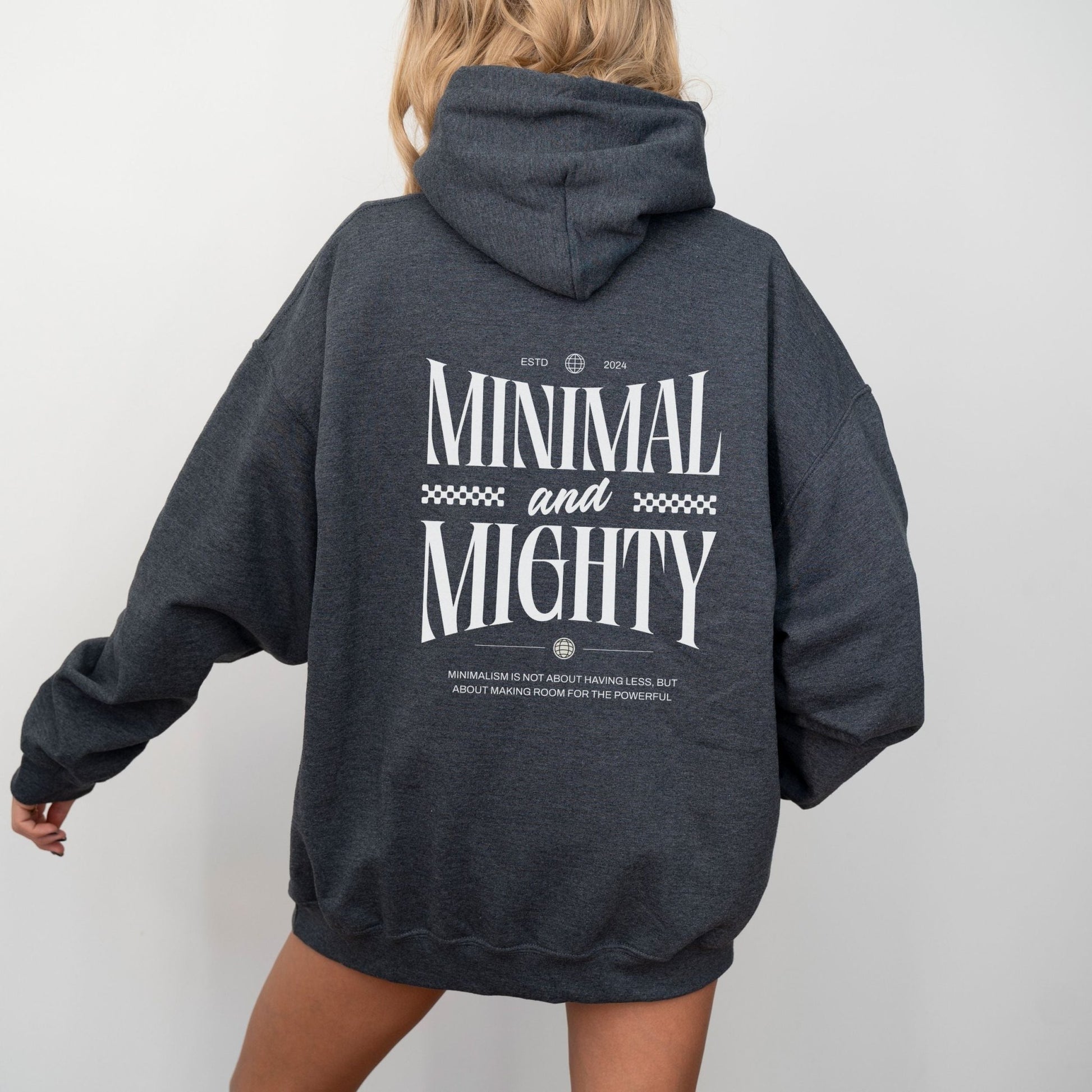 Minimal and Mighty hoodie with bold typography design.