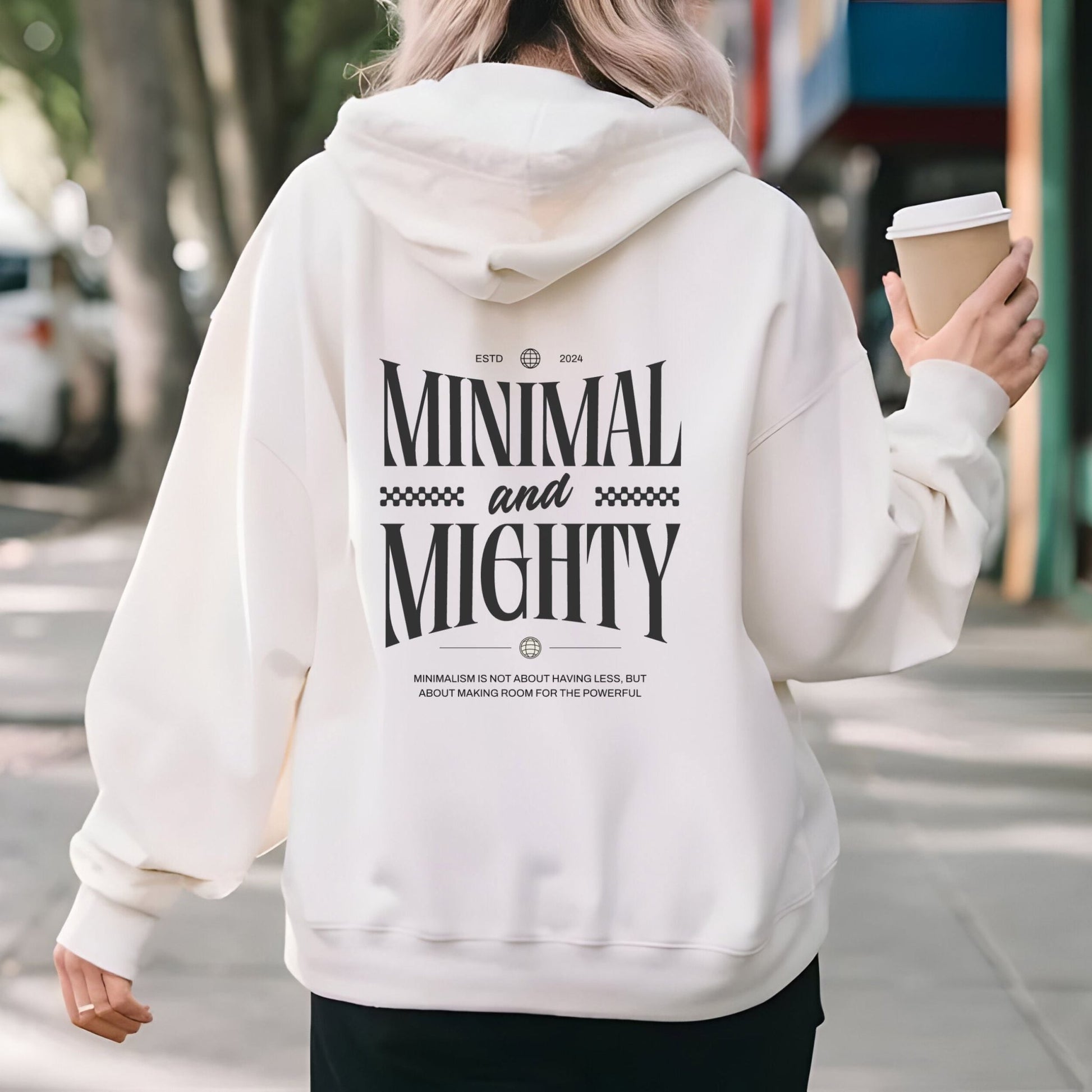 Minimal and Mighty hoodie with bold typography design.