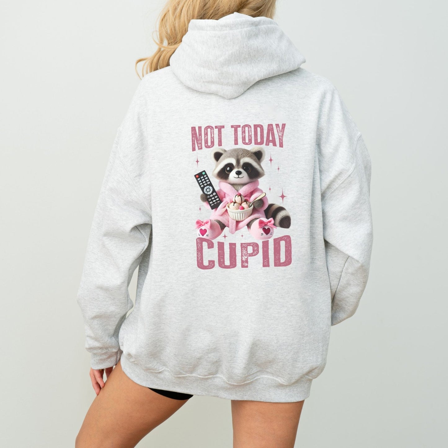 Not Today Cupid hoodie with a funny raccoon graphic, cozy and sassy Valentine's Day humor apparel.