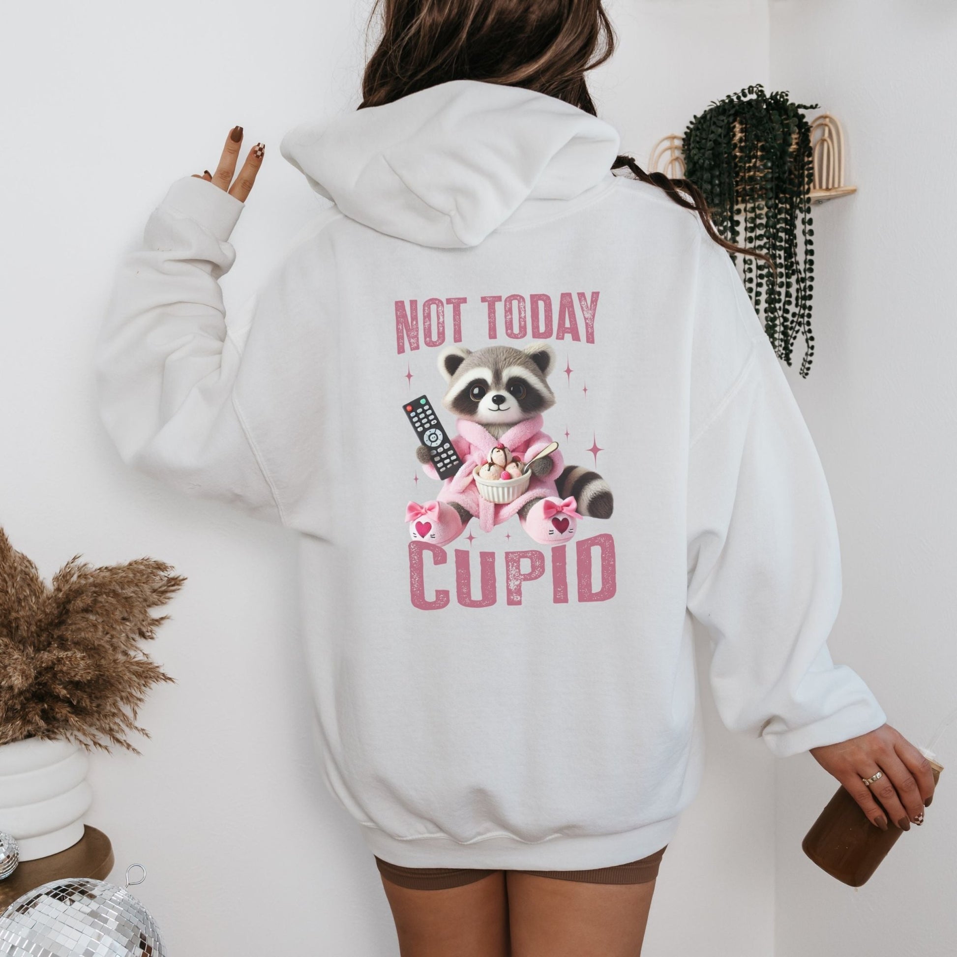 Not Today Cupid hoodie with a funny raccoon graphic, cozy and sassy Valentine's Day humor apparel.