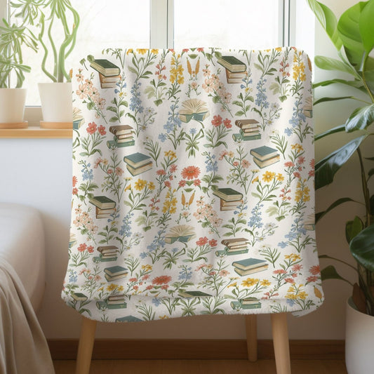 Floral book blanket with plush sherpa and velveteen options, featuring a literary floral design.