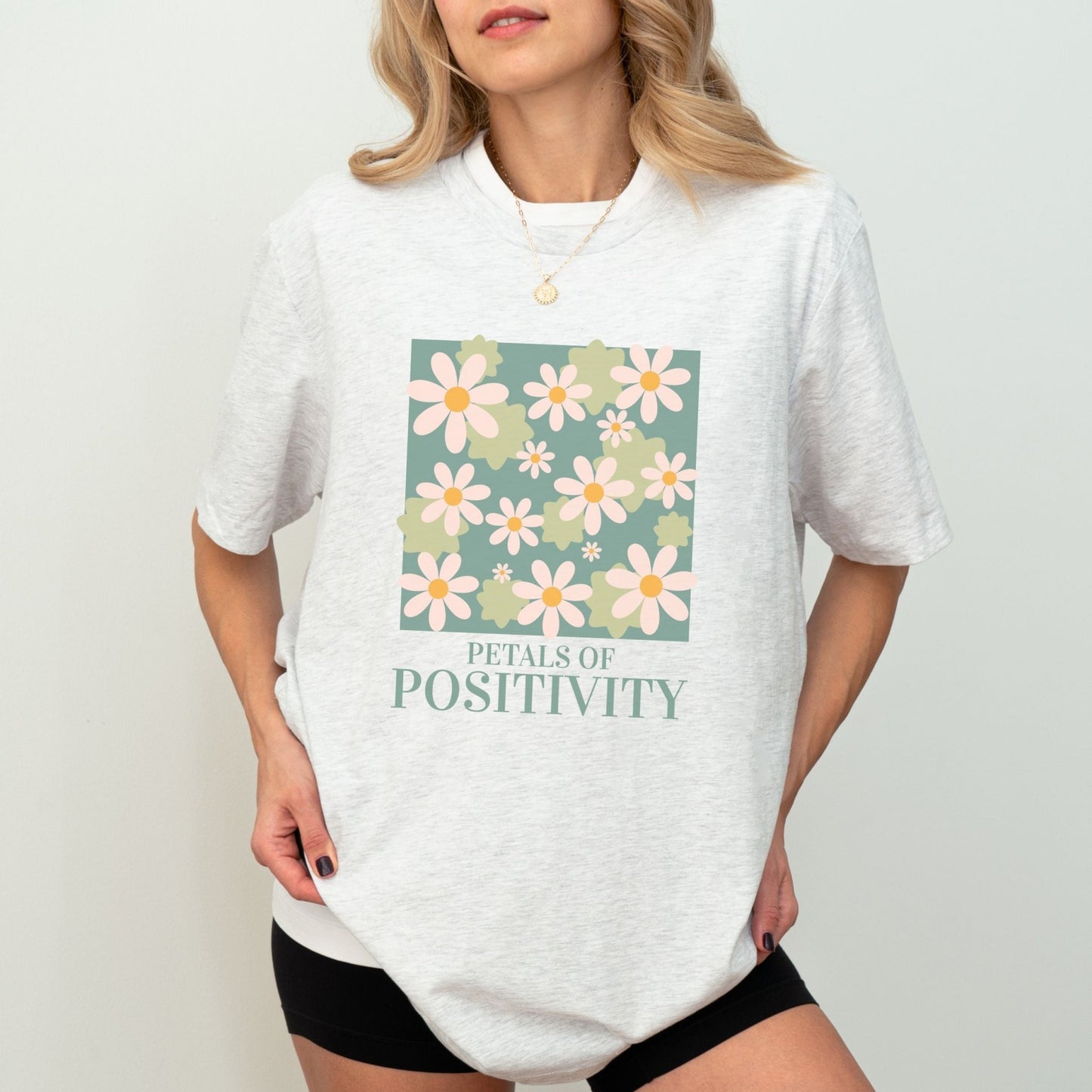 Petals of Positivity t-shirt with a floral design and positive message, available in 7 colors