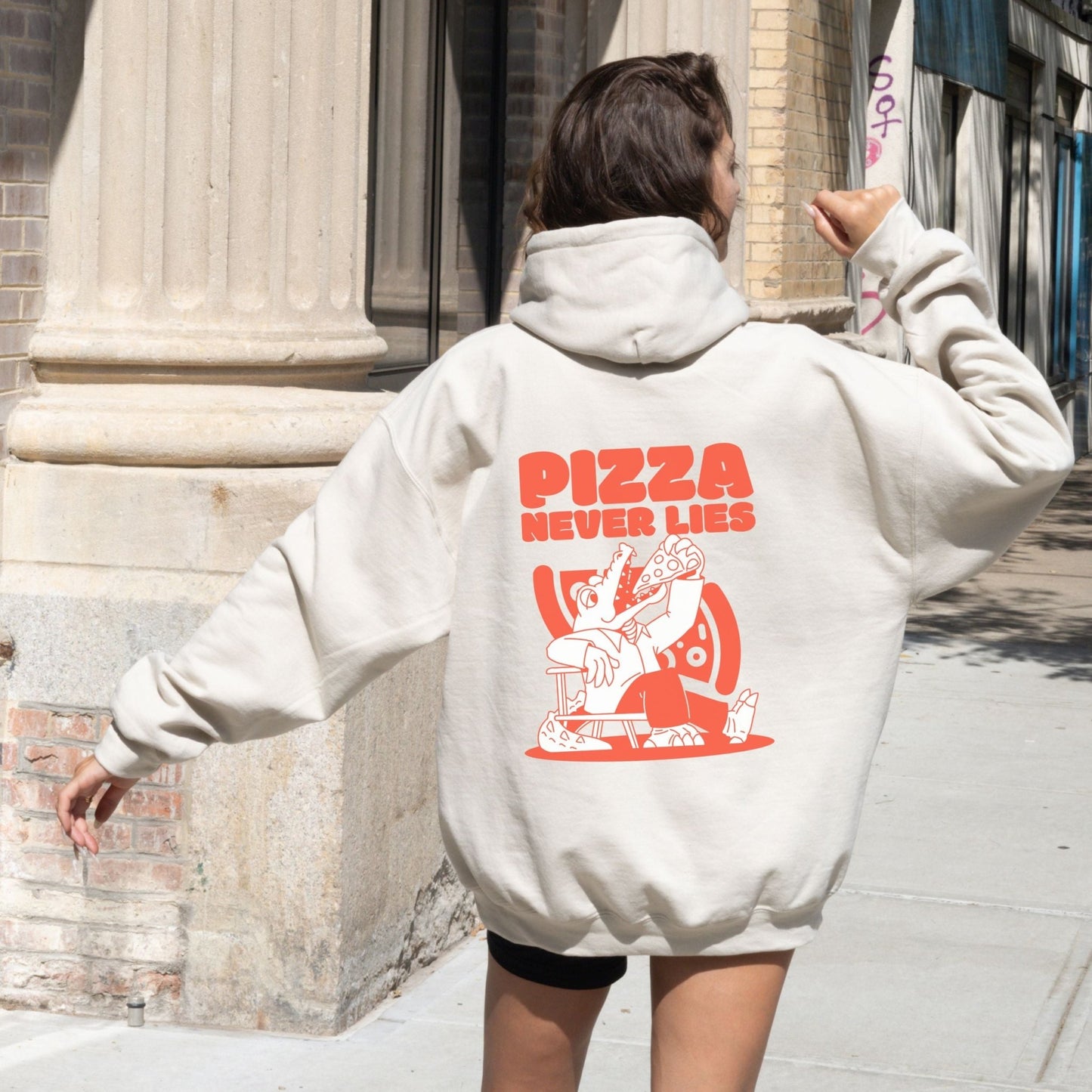 Pizza lover hoodie with a quirky alligator eating pizza design.