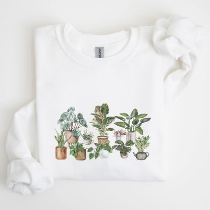 Cozy unisex sweatshirt featuring a watercolor-style houseplant graphic — perfect for plant lovers and indoor garden aesthetic fans.