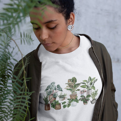 Cozy unisex sweatshirt featuring a watercolor-style houseplant graphic — perfect for plant lovers and indoor garden aesthetic fans.
