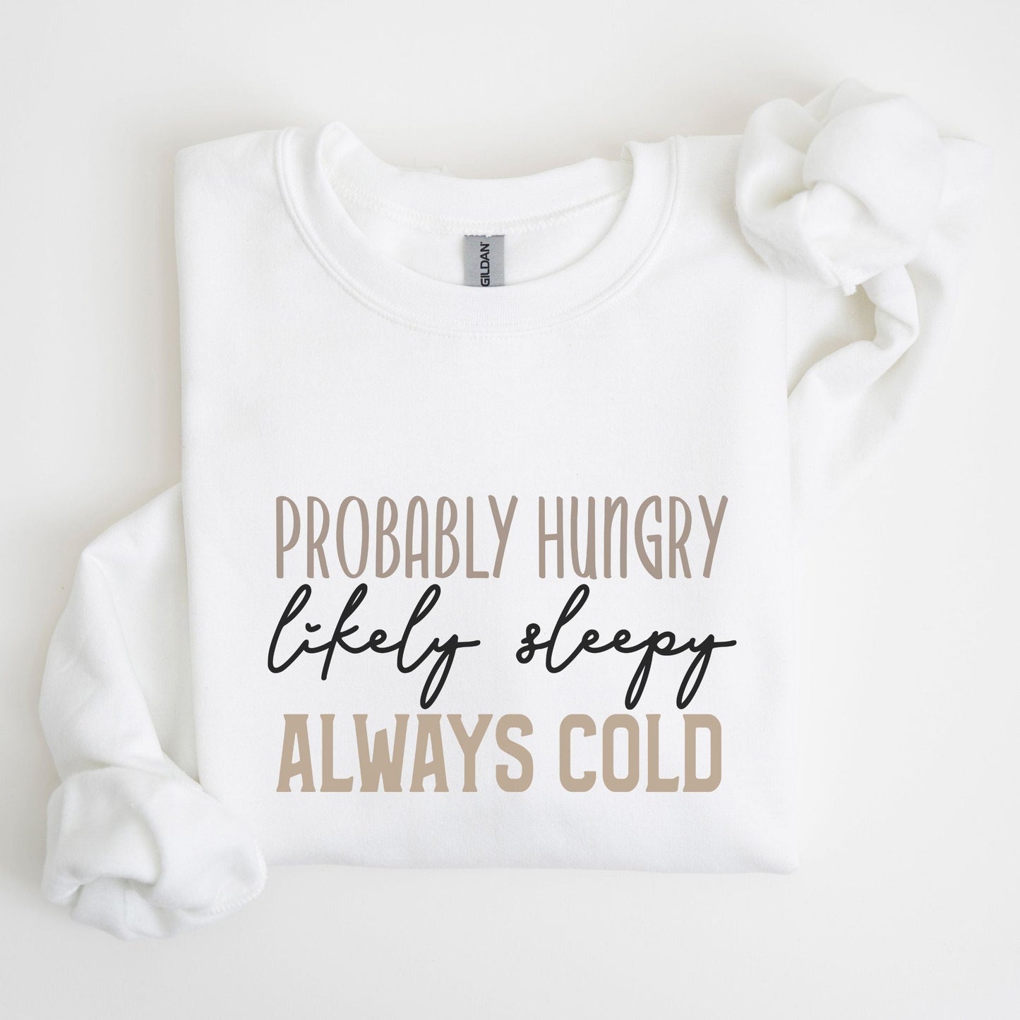 Funny “Probably Hungry, Always Cold” sweatshirt with neutral text on a cozy crewneck — perfect for comfort lovers and snack queens.
