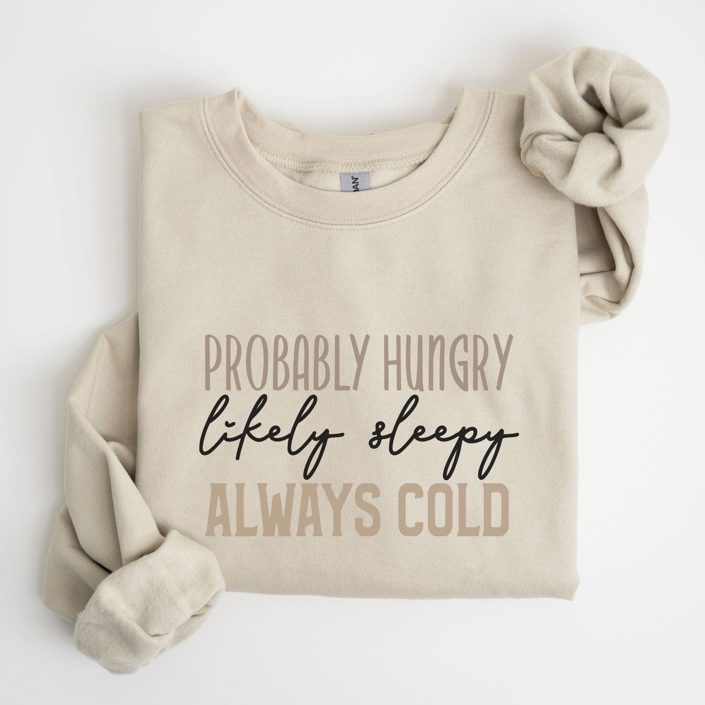 Funny “Probably Hungry, Always Cold” sweatshirt with neutral text on a cozy crewneck — perfect for comfort lovers and snack queens.
