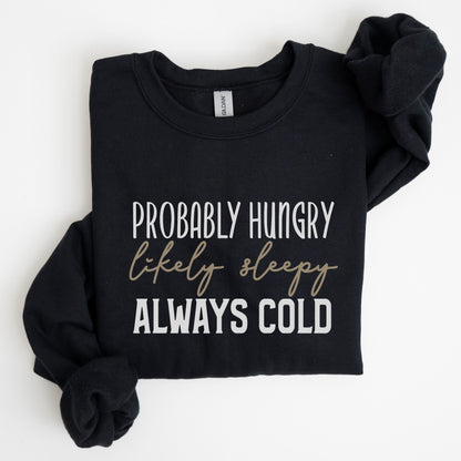 Funny “Probably Hungry, Always Cold” sweatshirt with neutral text on a cozy crewneck — perfect for comfort lovers and snack queens.