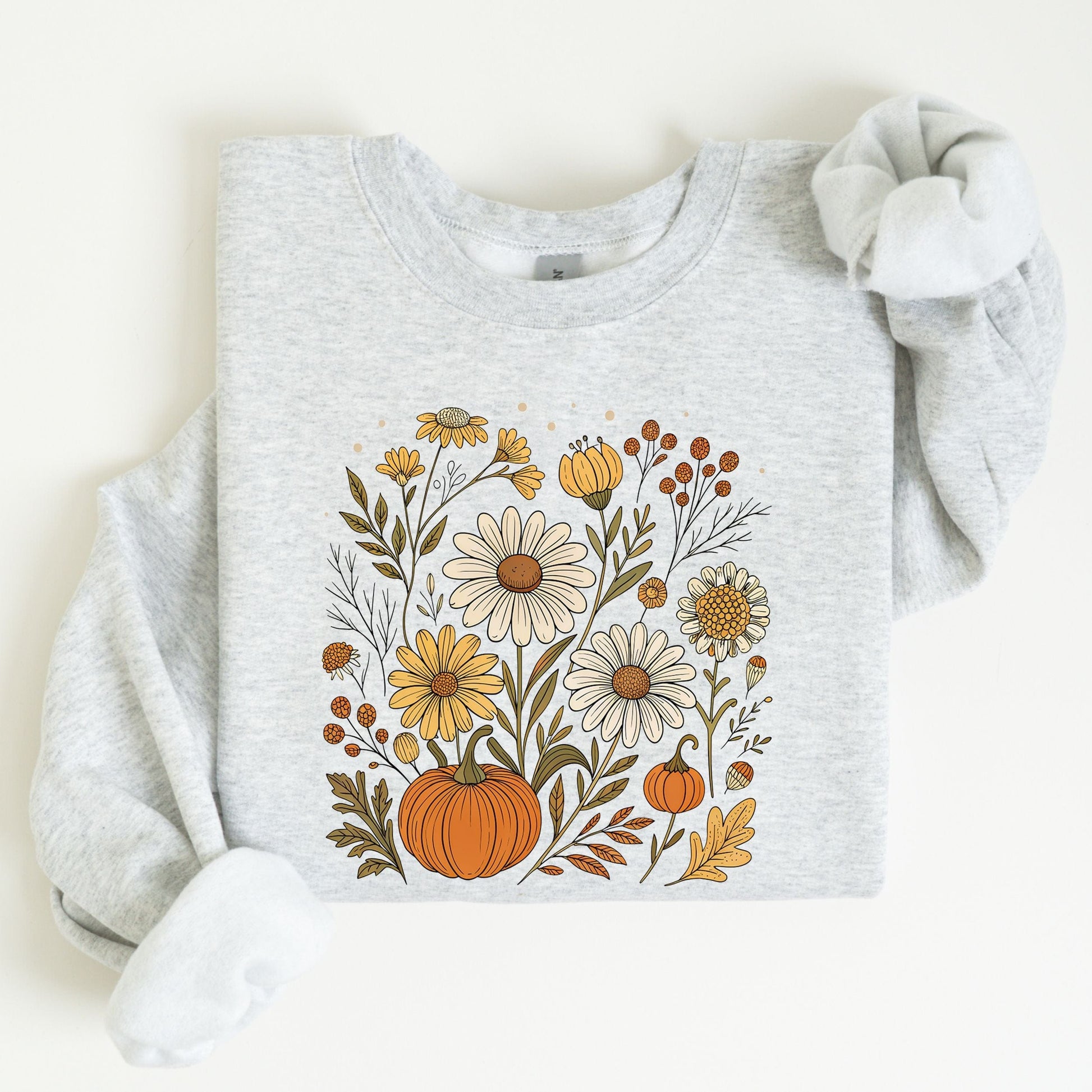 Pumpkin and wildflower fall sweatshirt in neutral tones, cozy autumn cottagecore style