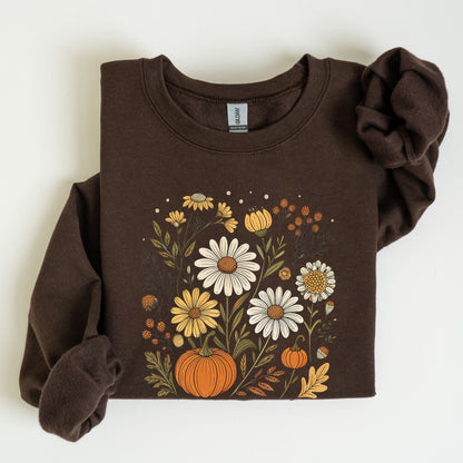 Pumpkin and wildflower fall sweatshirt in neutral tones, cozy autumn cottagecore style