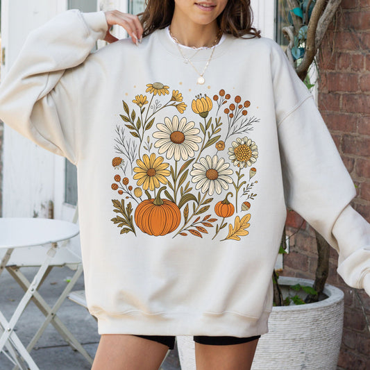 Pumpkin and wildflower fall sweatshirt in neutral tones, cozy autumn cottagecore style