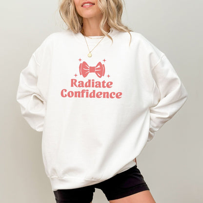 Radiate Confidence sweatshirt with a cute bow design in vibrant colors, empowering and cozy apparel.