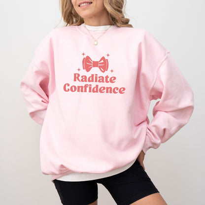 Radiate Confidence sweatshirt with a cute bow design in vibrant colors, empowering and cozy apparel.