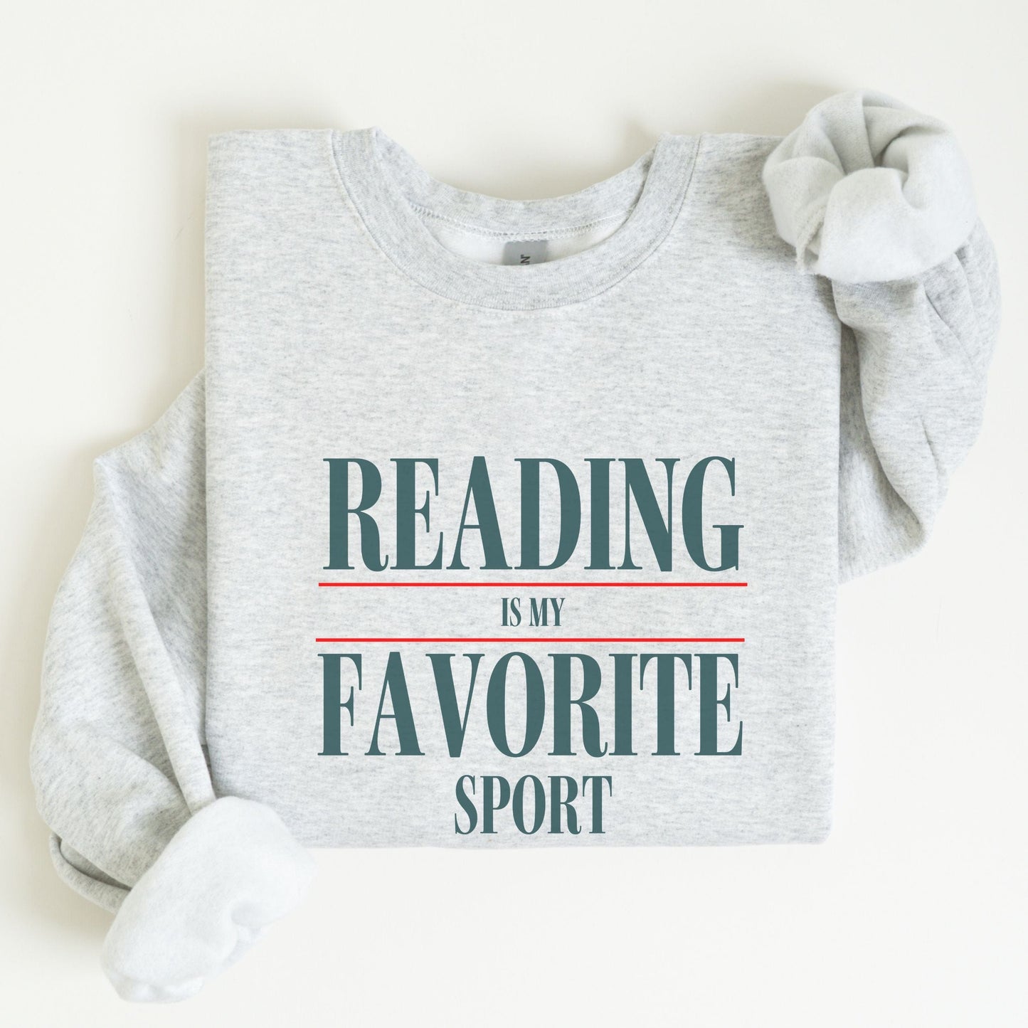 “Reading is My Favorite Sport” sweatshirt with bold varsity-style typography — cozy reader crewneck for book lovers and literary fans.