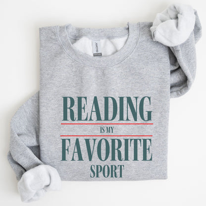 “Reading is My Favorite Sport” sweatshirt with bold varsity-style typography — cozy reader crewneck for book lovers and literary fans.