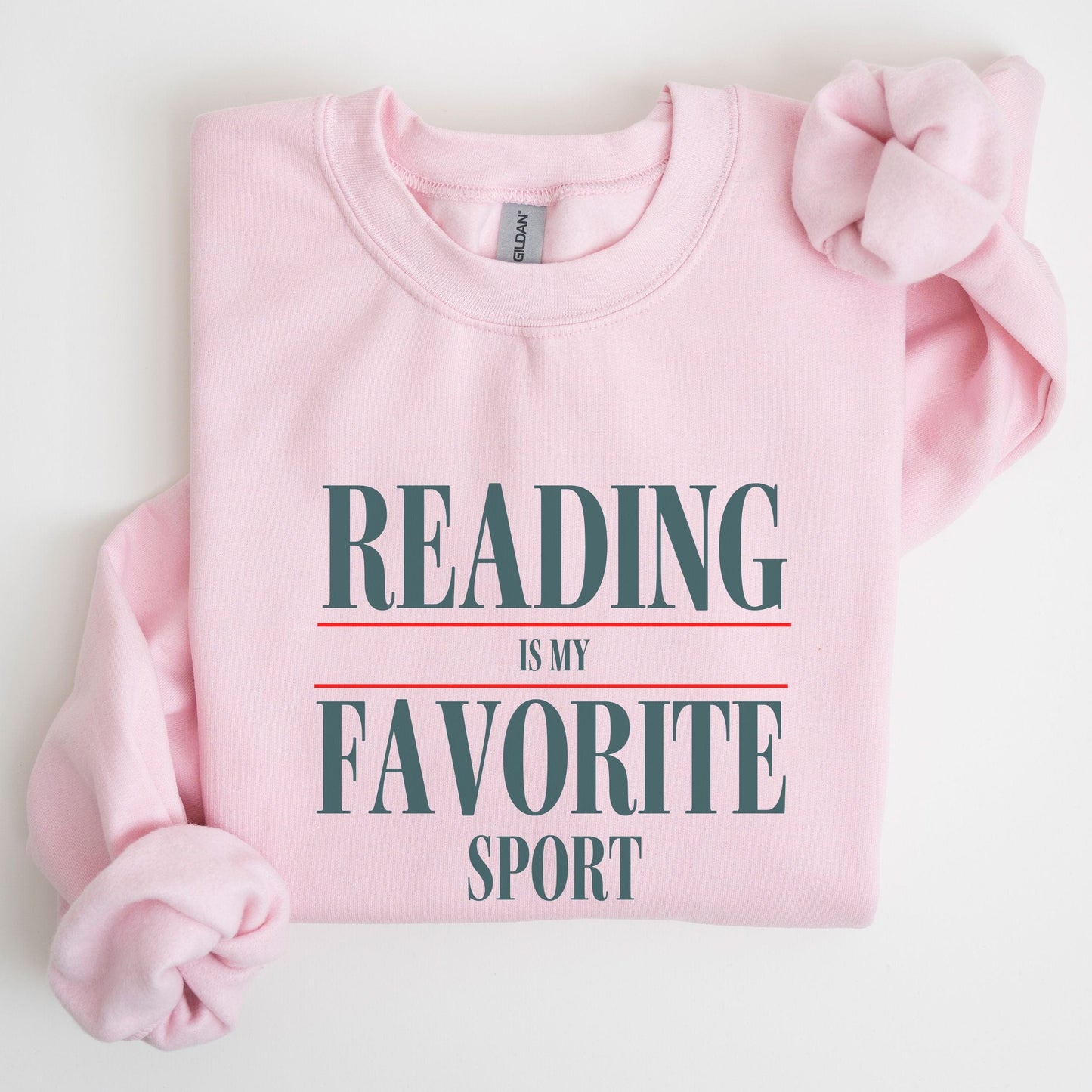 “Reading is My Favorite Sport” sweatshirt with bold varsity-style typography — cozy reader crewneck for book lovers and literary fans.