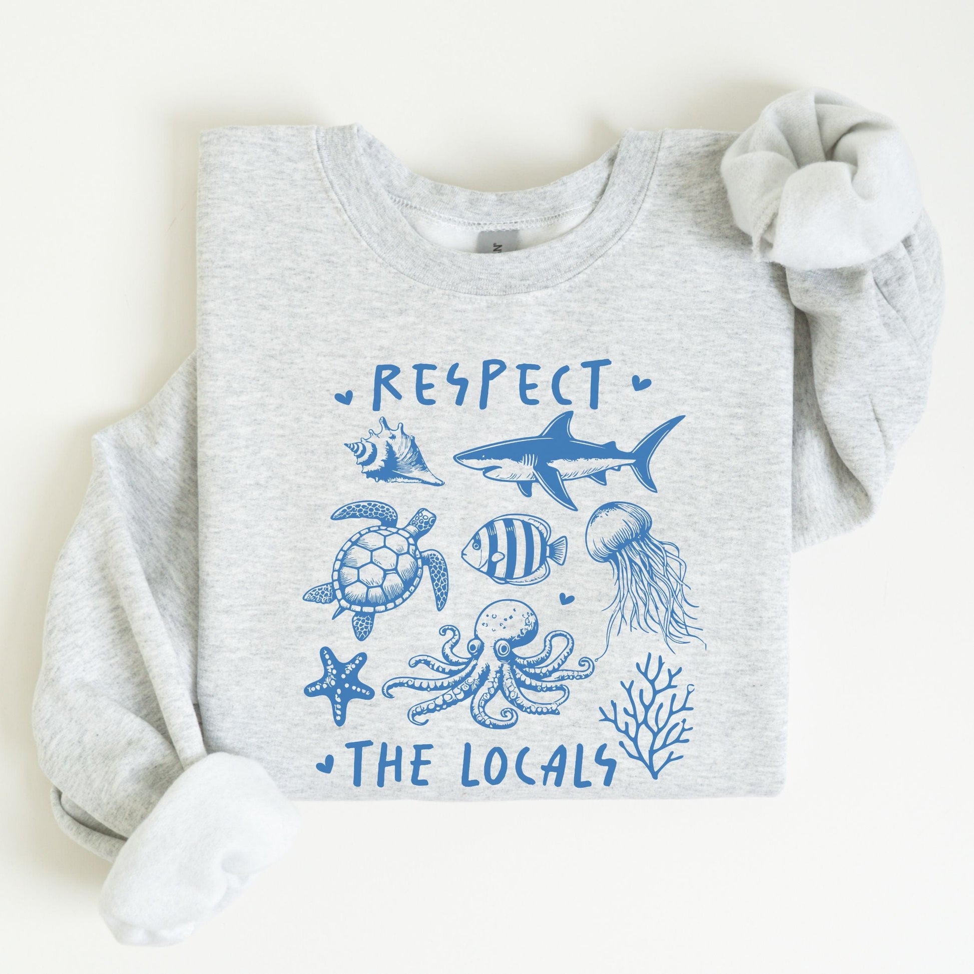 Respect the Locals sweatshirt with sea creatures in blue line art for ocean lovers