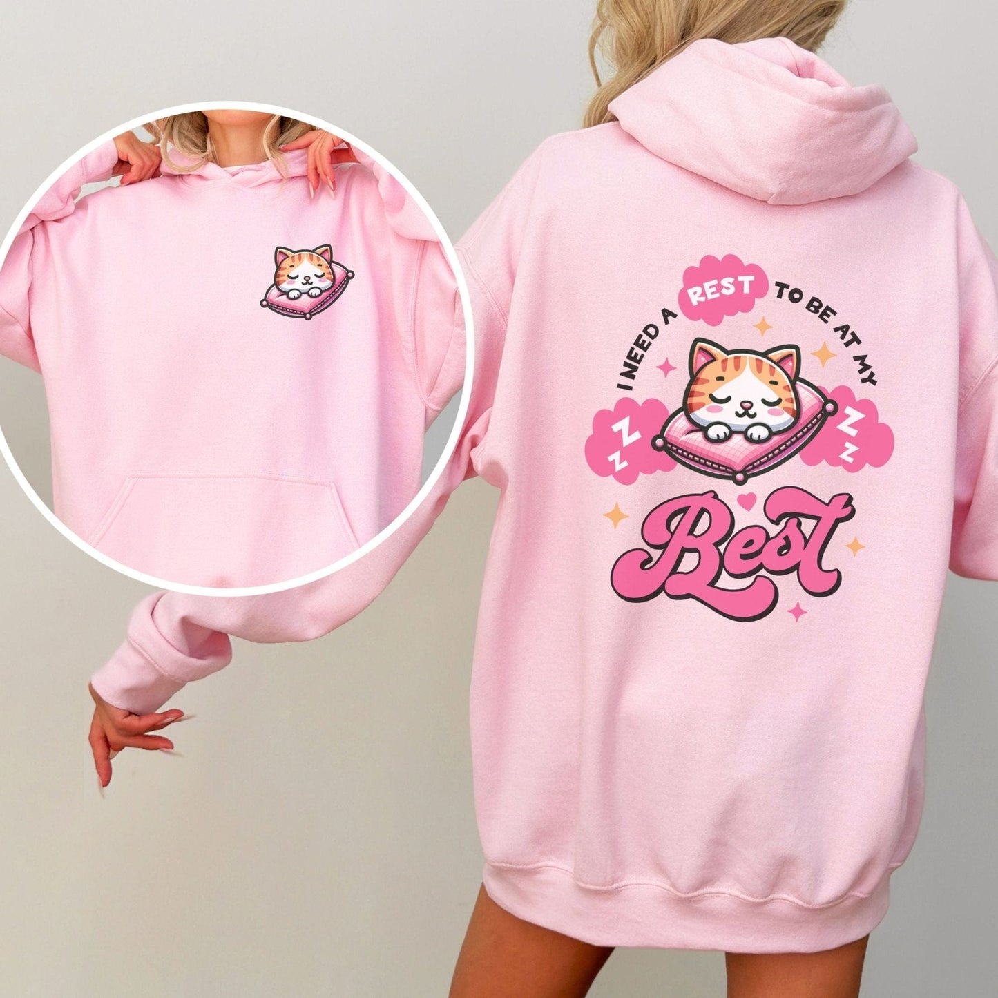 Kawaii hoodie with "Rest to Be at Your Best" back design featuring a cute cat sleeping on a pillow, and a matching mini cat graphic on the front chest.