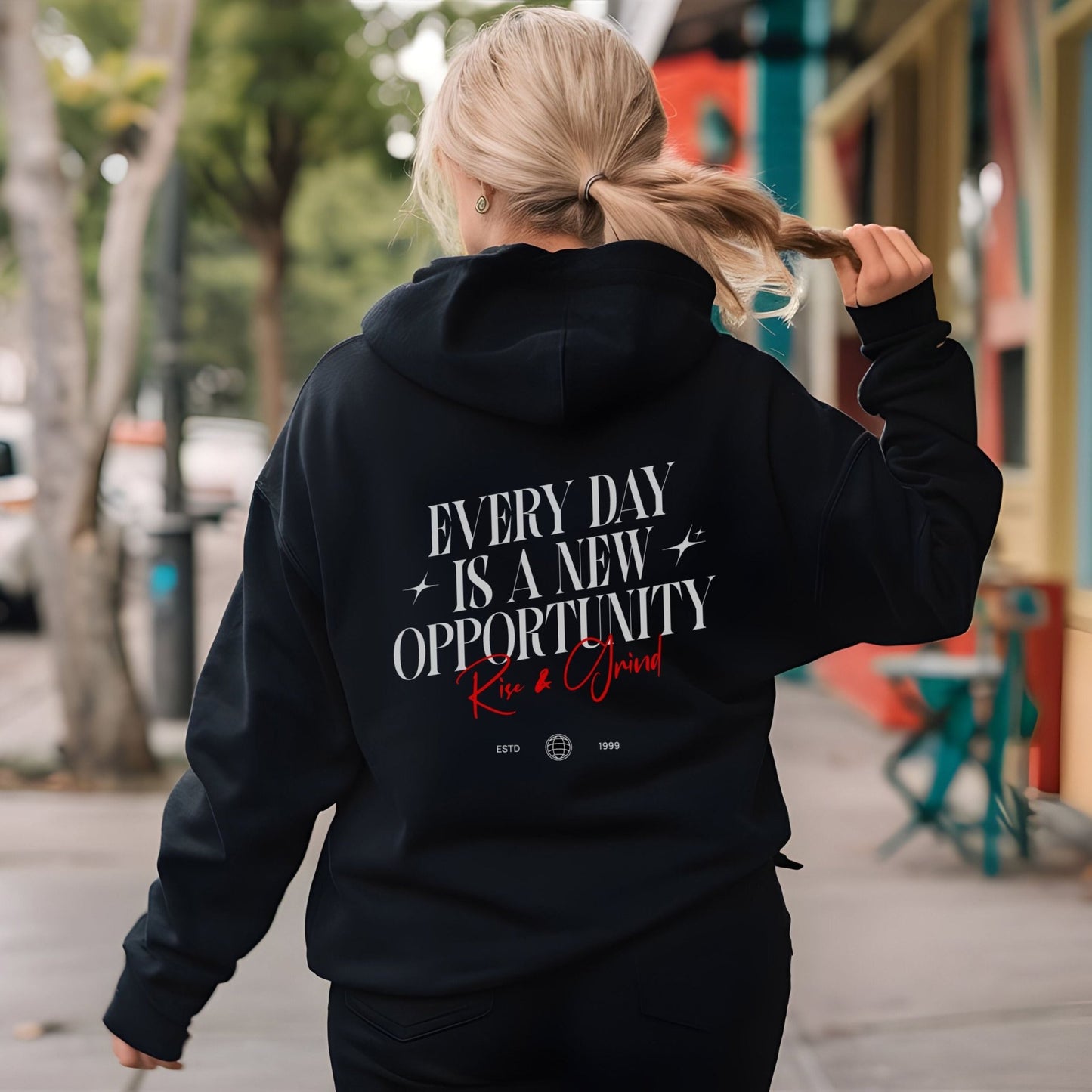 Rise & Grind motivational hoodie with minimalist typography design for daily inspiration.