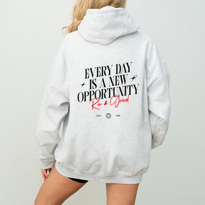 Rise & Grind motivational hoodie with minimalist typography design for daily inspiration.