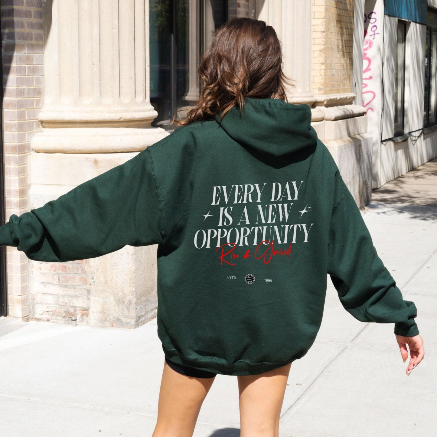 Rise & Grind motivational hoodie with minimalist typography design for daily inspiration.