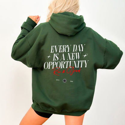 Rise & Grind motivational hoodie with minimalist typography design for daily inspiration.