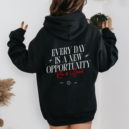 Rise & Grind motivational hoodie with minimalist typography design for daily inspiration.