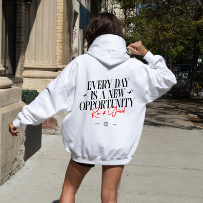 Rise & Grind motivational hoodie with minimalist typography design for daily inspiration.