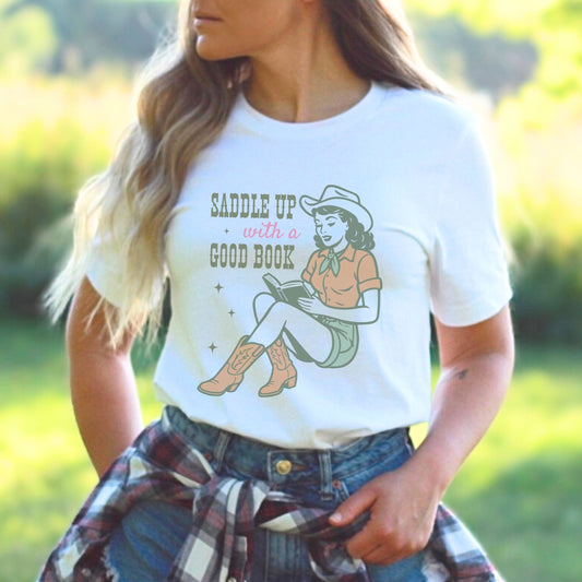 Person wearing western-style book lover t-shirt with pastel cowgirl