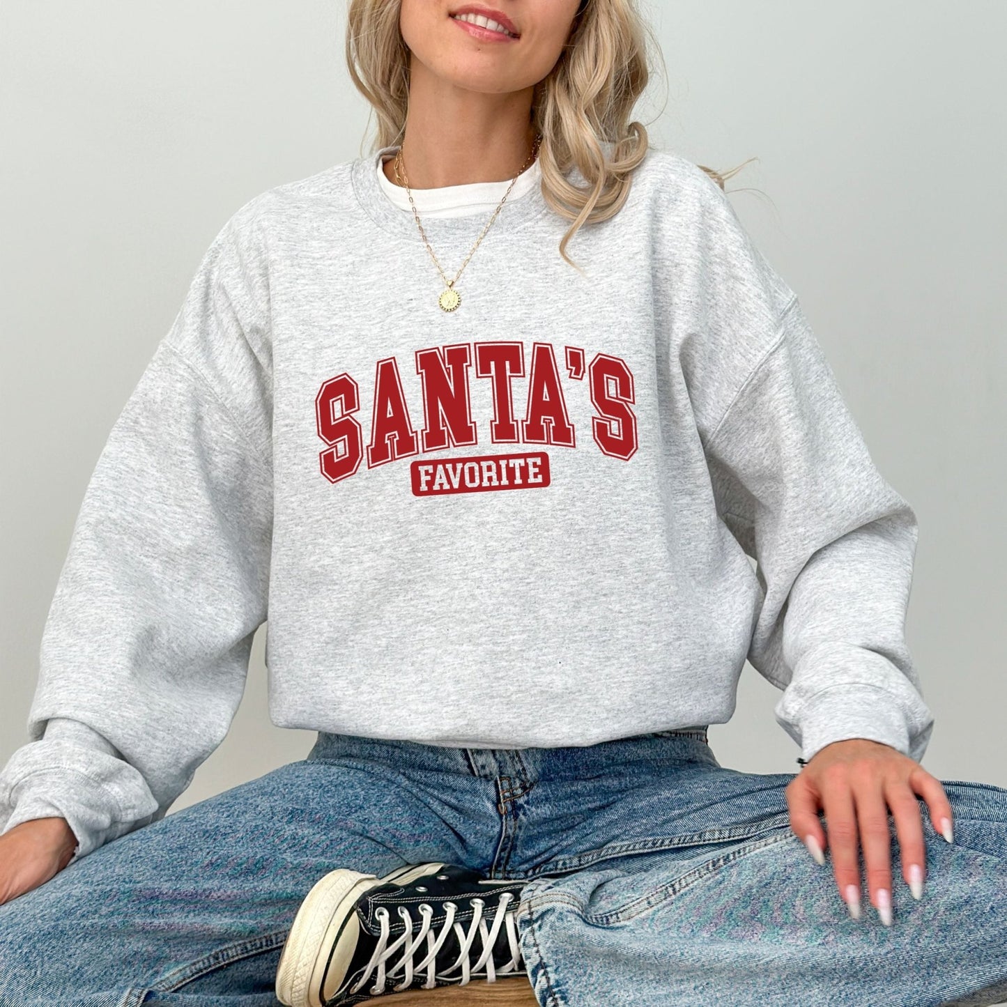 Santa's Favorite holiday sweatshirt with festive graphic design, perfect for Christmas and winter wardrobe.