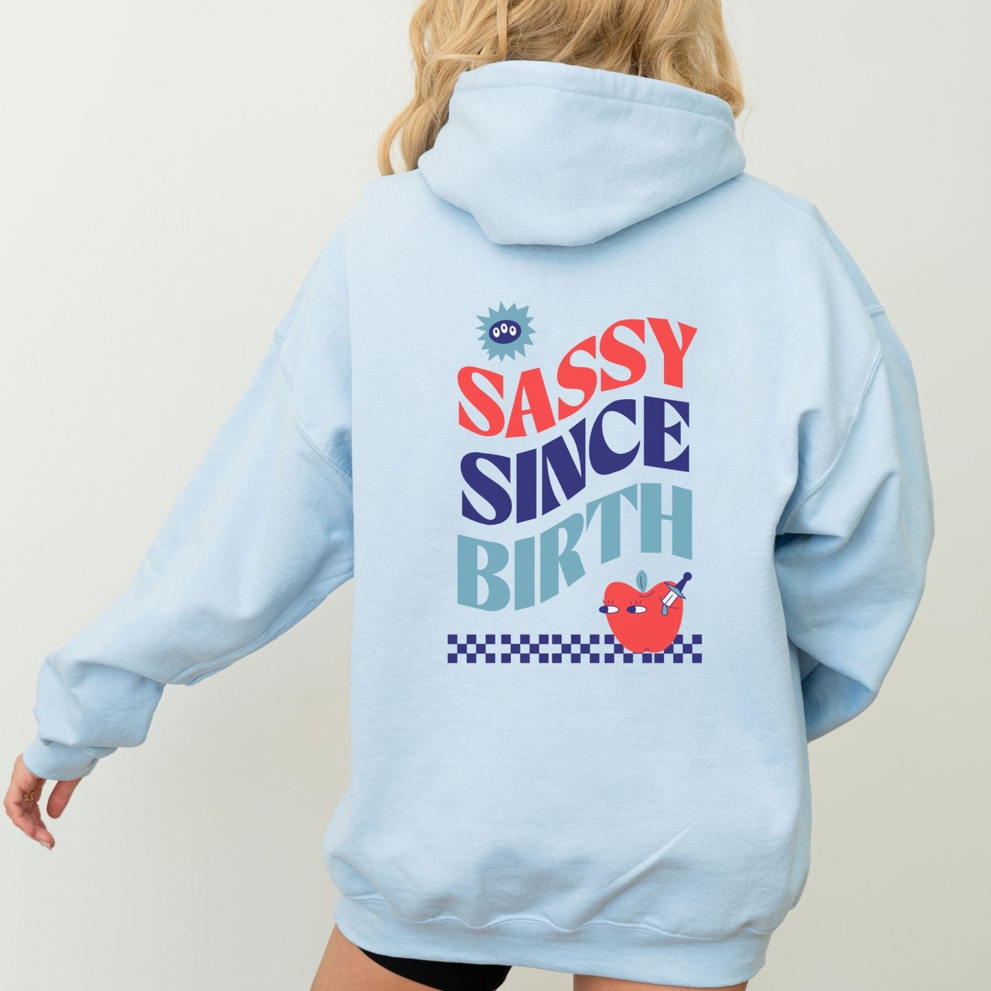 Sassy Since Birth hoodie with bold typography and colorful graphic design, cozy and available in 6 colors.