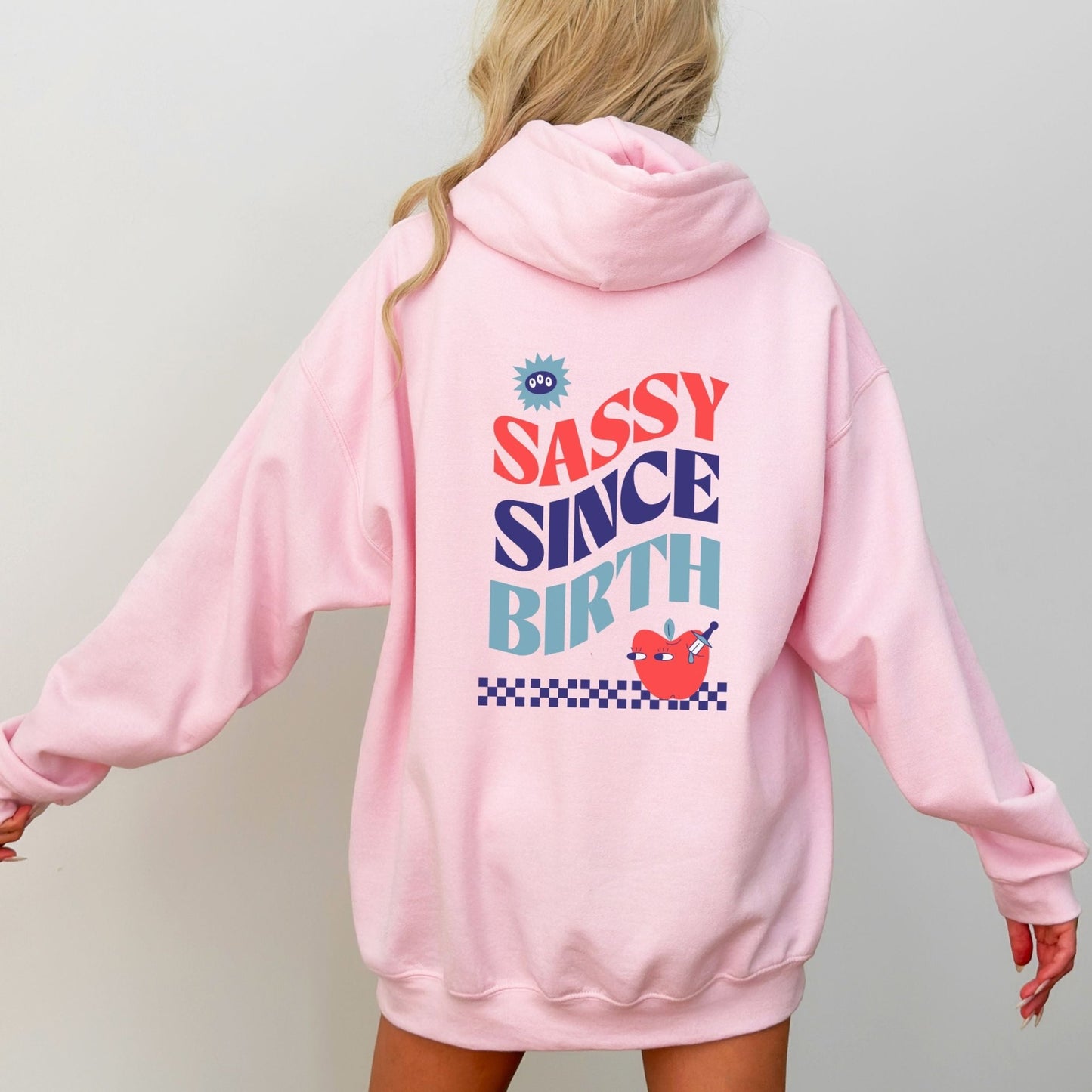 Sassy Since Birth hoodie with bold typography and colorful graphic design, cozy and available in 6 colors.