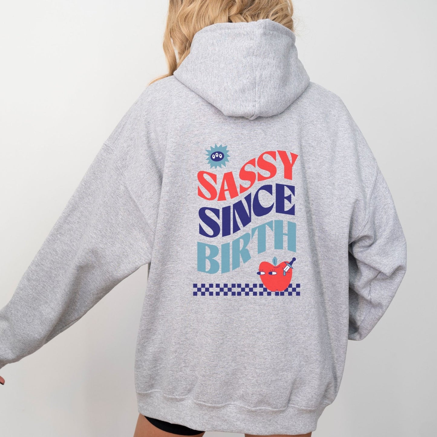 Sassy Since Birth hoodie with bold typography and colorful graphic design, cozy and available in 6 colors.