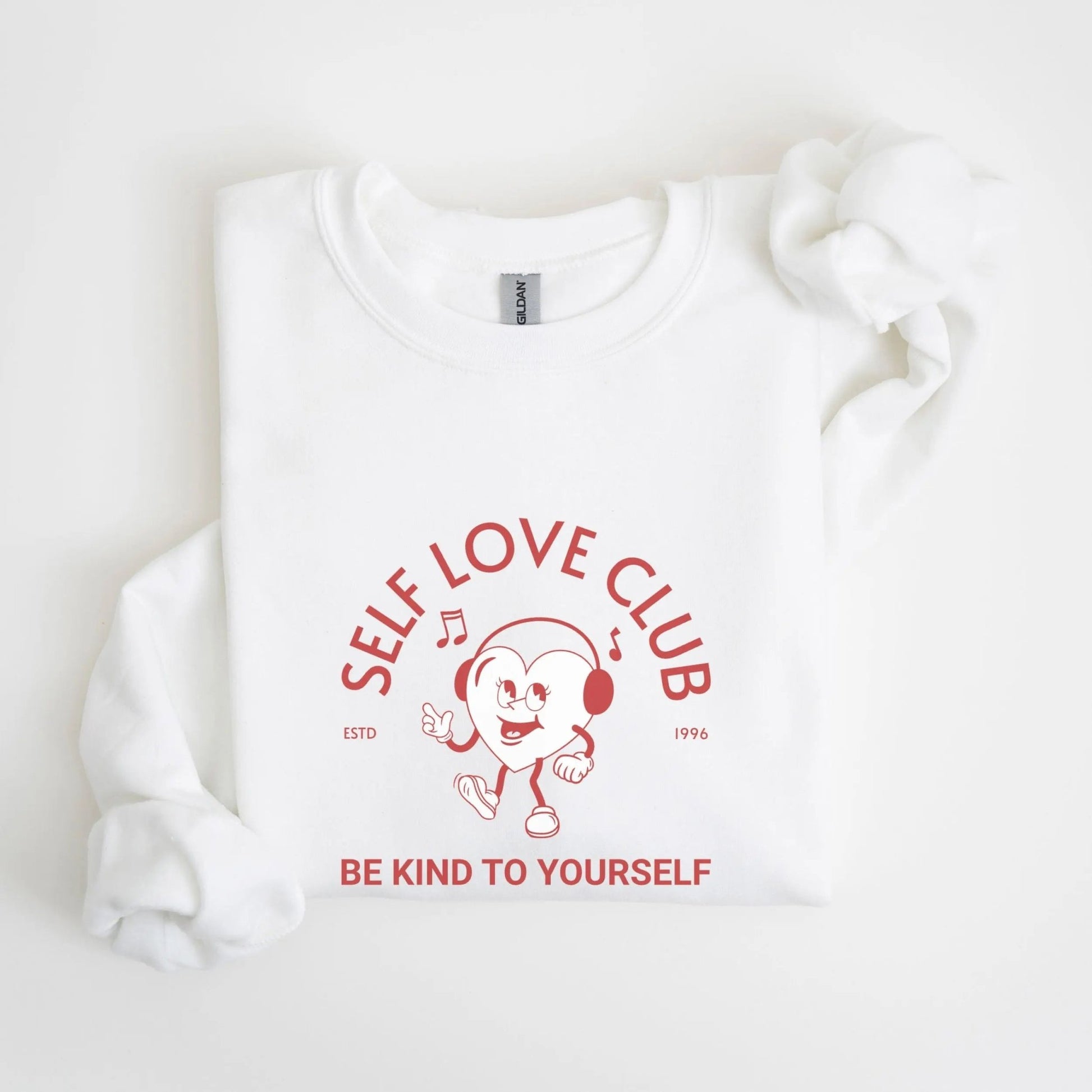 Self Love Club sweatshirt, vintage-inspired design, Y2K streetwear, cheerful heart character.