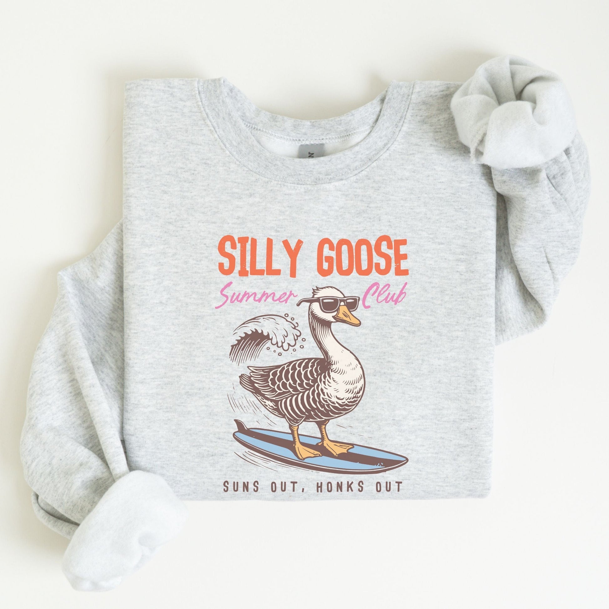 Silly Goose summer sweatshirt with surfing goose graphic and retro beach theme