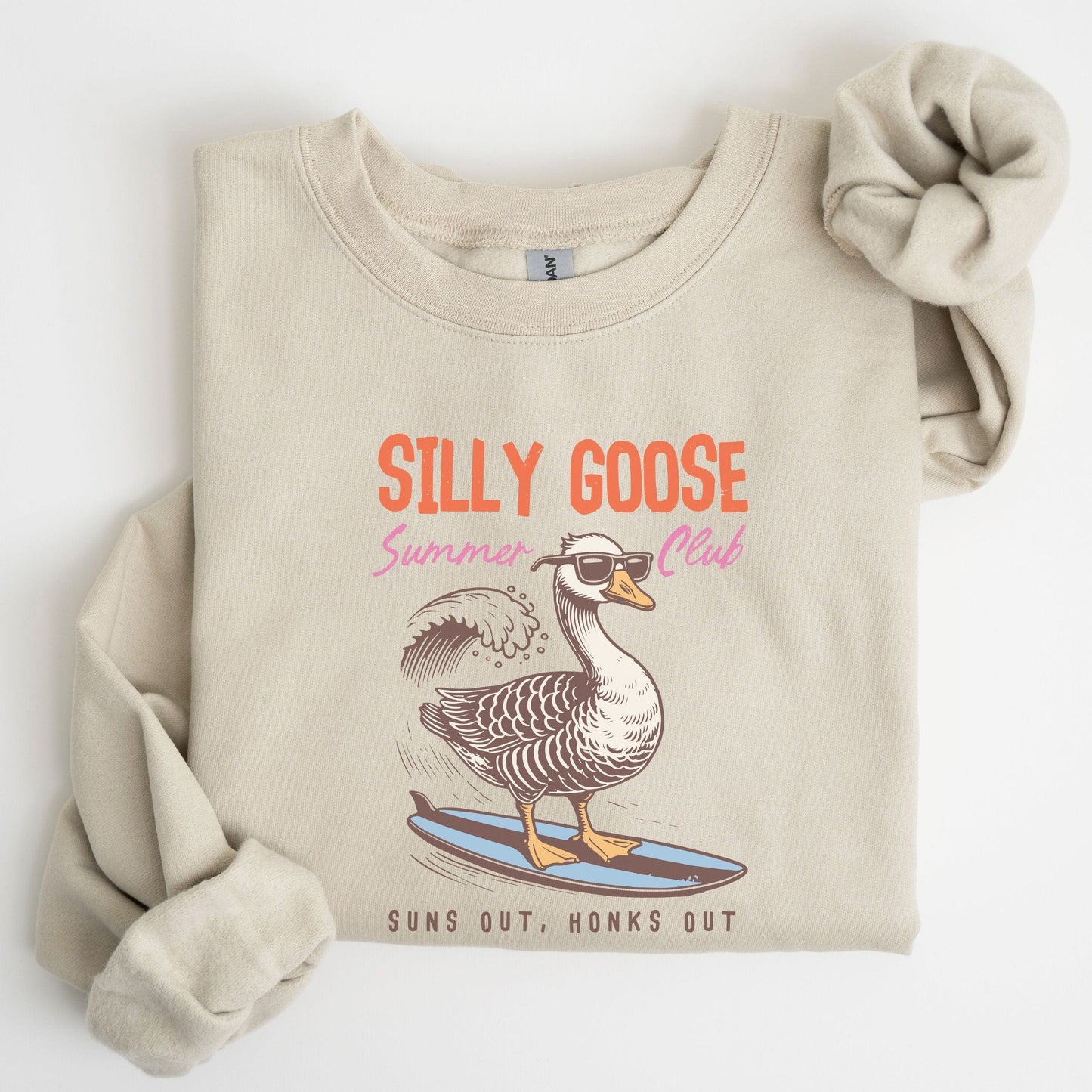 Silly Goose summer sweatshirt with surfing goose graphic and retro beach theme